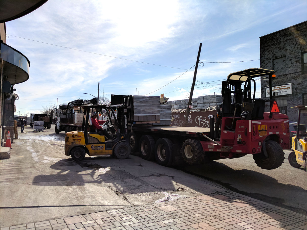 Trailer unloading alongside the block stacks