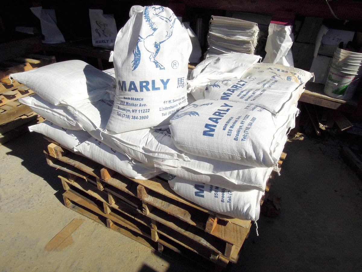 Palletized bagged material staged for pickup
