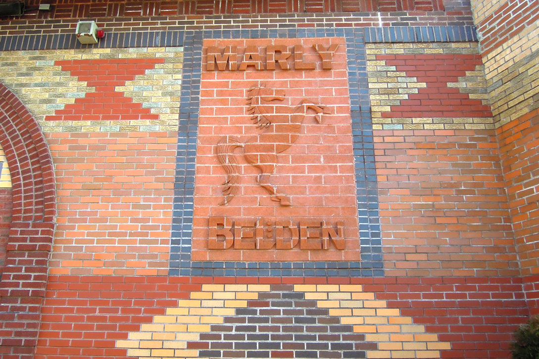 Brick and tile relief of the Marly horse