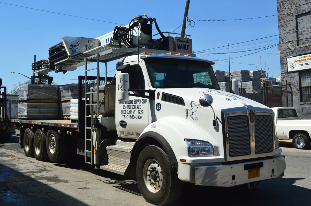 Boom truck loaded with palletized block