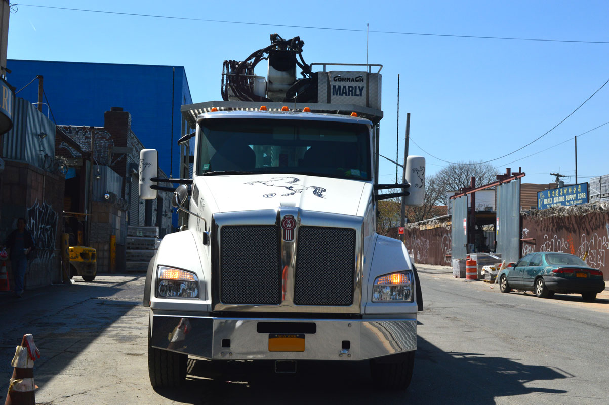 Boom truck pulling out onto Meeker Avenue
