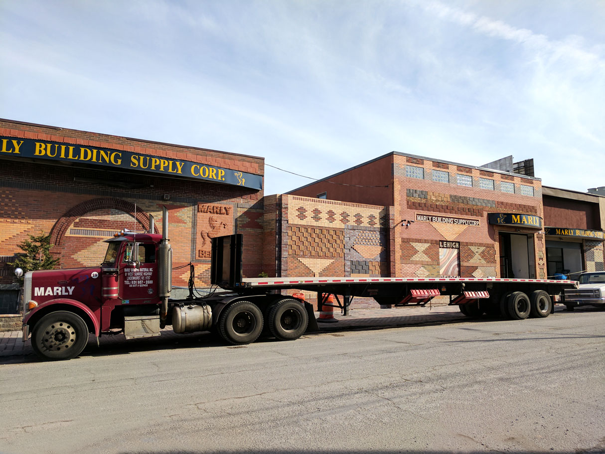 Flatbed loaded in front of the storefront